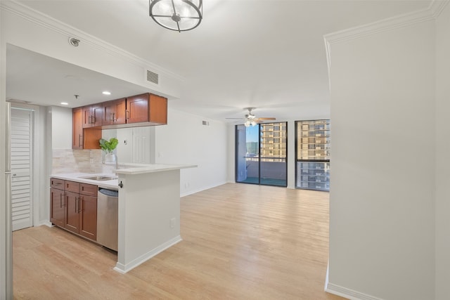 kitchen featuring ceiling fan, sink, tasteful backsplash, light hardwood / wood-style flooring, and stainless steel dishwasher