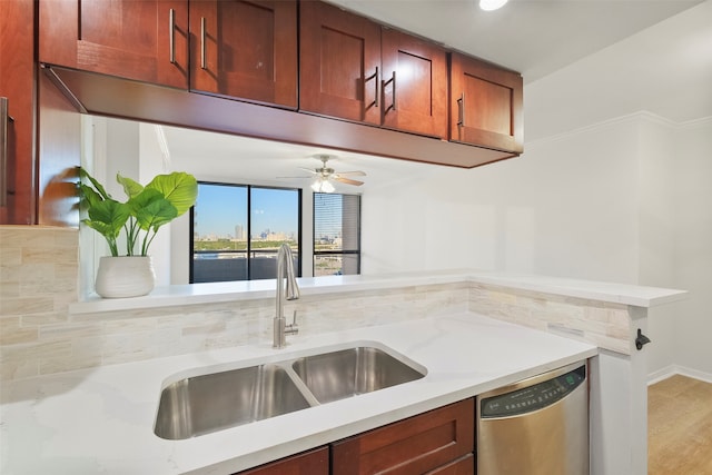 kitchen with tasteful backsplash, ceiling fan, sink, light hardwood / wood-style flooring, and dishwasher