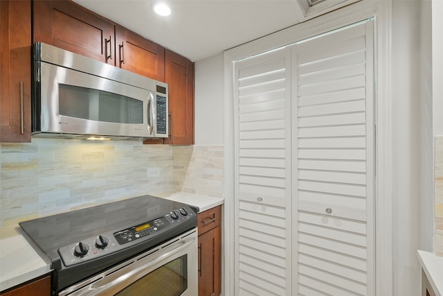 kitchen featuring backsplash and stainless steel appliances