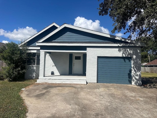 view of front facade with a porch and a garage