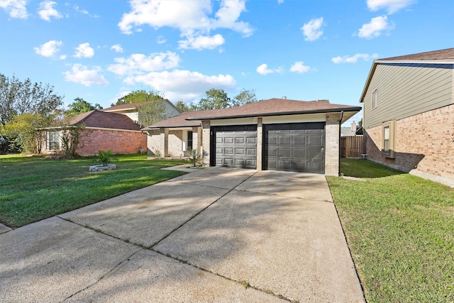 view of front facade with a front yard and a garage