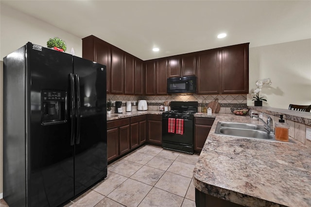 kitchen featuring tasteful backsplash, dark brown cabinetry, sink, black appliances, and light tile patterned floors