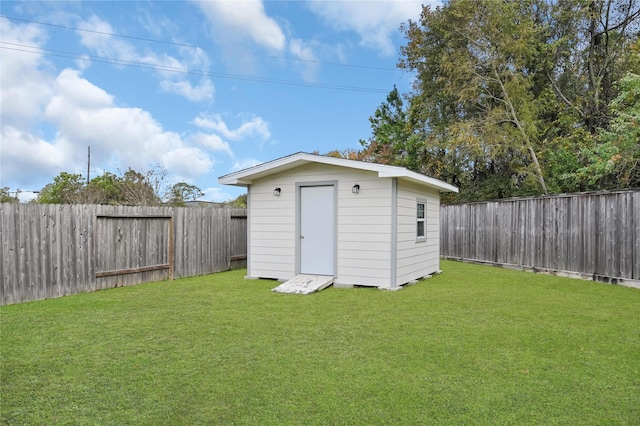 view of outbuilding with a lawn