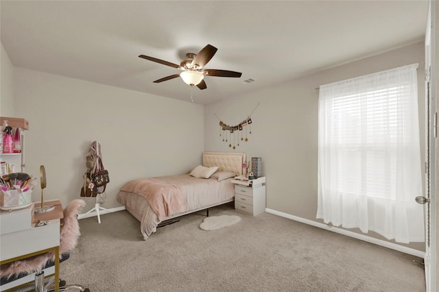 bedroom with ceiling fan and carpet floors