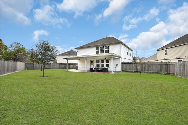 rear view of property with a patio area and a yard