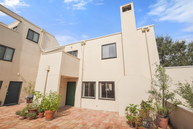 rear view of property with a patio