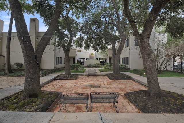 surrounding community with a patio