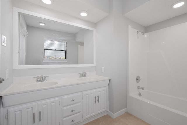 bathroom featuring tile patterned floors, vanity, and bathing tub / shower combination