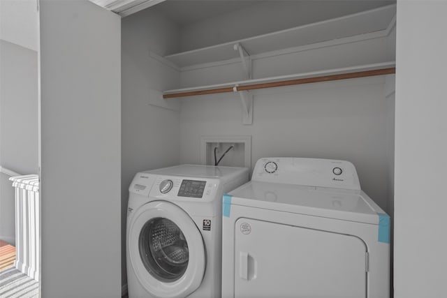 laundry area with independent washer and dryer