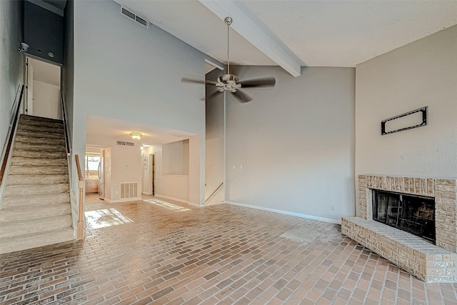 unfurnished living room featuring a fireplace, baseboards, visible vents, and ceiling fan