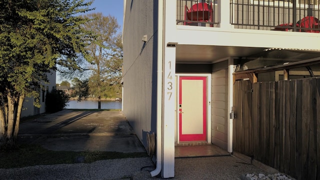 doorway to property featuring a water view