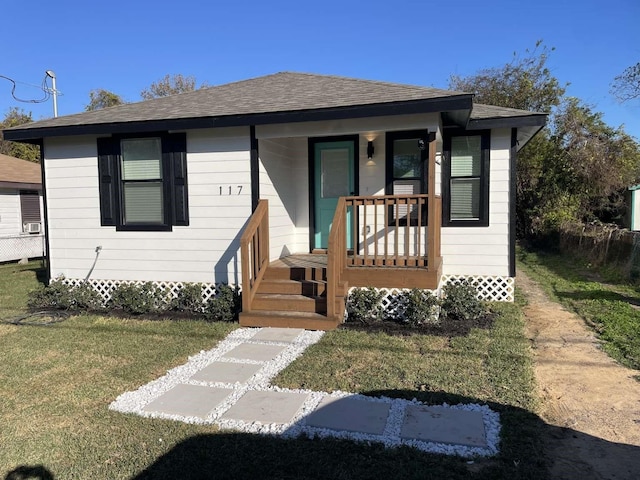 bungalow with a front lawn