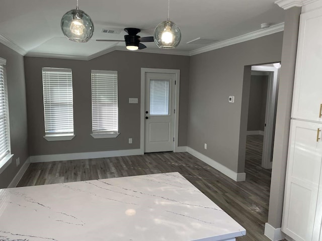 foyer entrance with ornamental molding, plenty of natural light, dark wood-type flooring, and ceiling fan