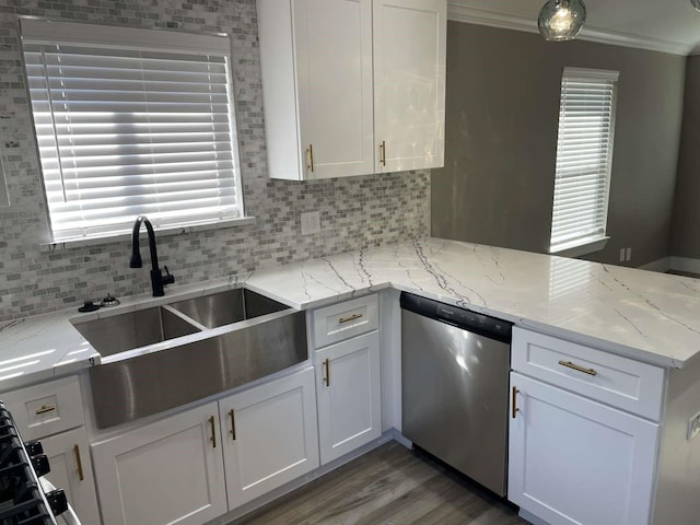 kitchen featuring light stone countertops, dishwasher, sink, white cabinets, and ornamental molding