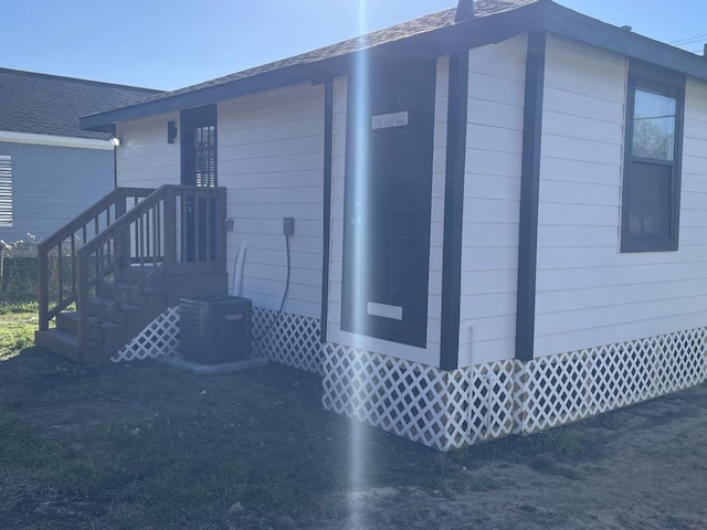 view of side of property featuring cooling unit