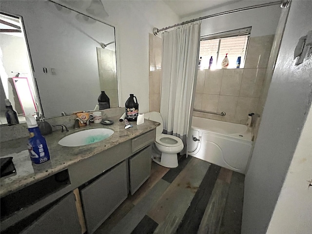 full bathroom featuring vanity, toilet, wood-type flooring, and shower / bath combo with shower curtain