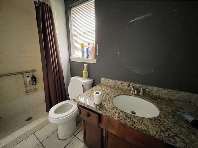 bathroom featuring tile patterned floors, toilet, vanity, and a shower with shower curtain