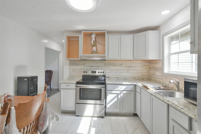 kitchen featuring exhaust hood, white cabinets, sink, decorative backsplash, and stainless steel appliances