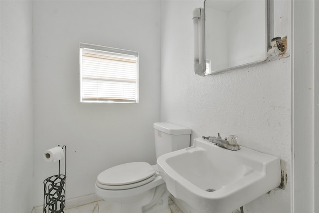 bathroom with toilet and sink