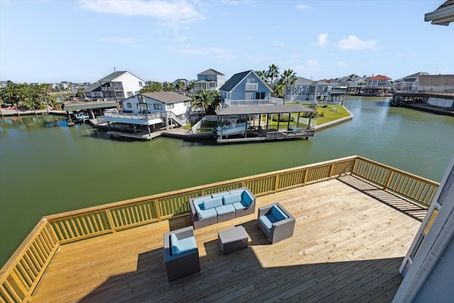 view of dock with outdoor lounge area and a deck with water view