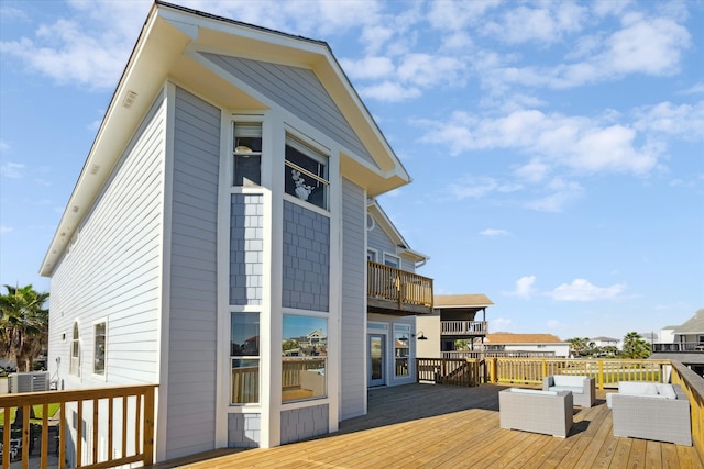 deck featuring outdoor lounge area