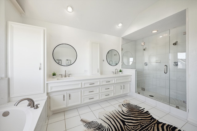 bathroom with plus walk in shower, tile patterned flooring, vanity, and vaulted ceiling