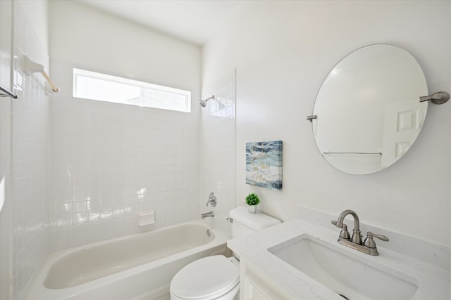 full bathroom with tiled shower / bath combo, toilet, and vanity