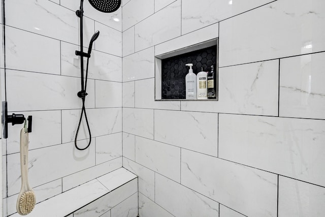 bathroom with a tile shower