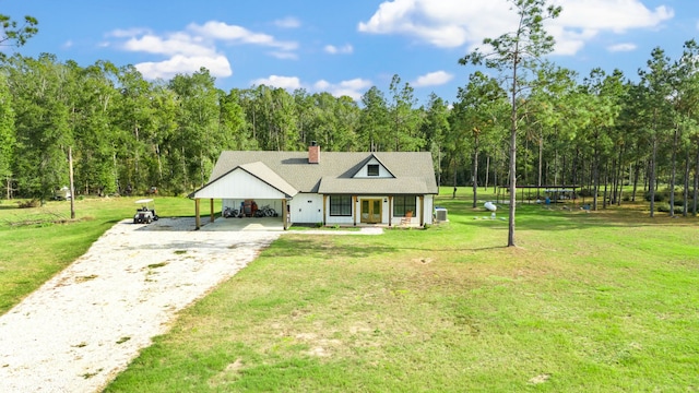 view of front of home with a front lawn, a porch, and a carport