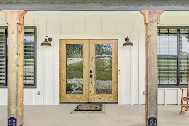 view of exterior entry featuring french doors