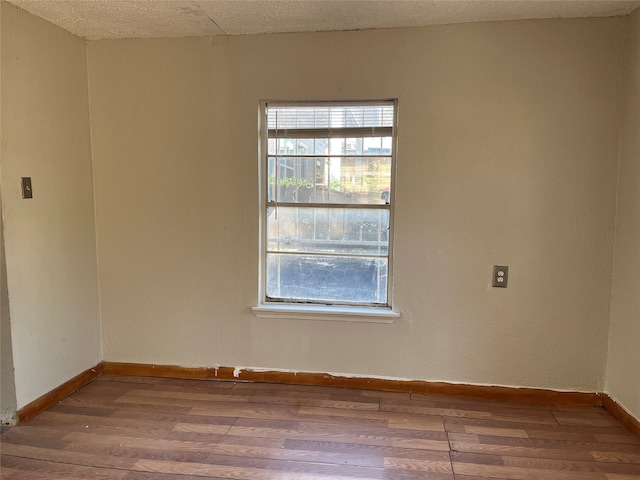 empty room featuring hardwood / wood-style flooring