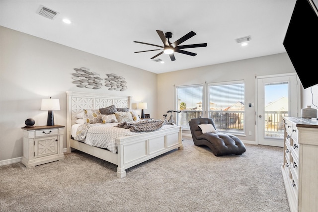 bedroom featuring access to exterior, light colored carpet, and ceiling fan