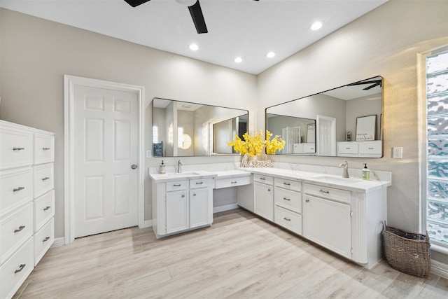 bathroom featuring vanity, hardwood / wood-style flooring, and ceiling fan