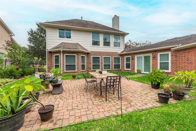 rear view of house featuring a patio