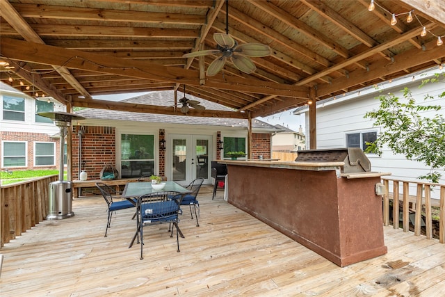 wooden terrace with ceiling fan and an outdoor bar