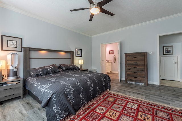 bedroom with connected bathroom, ceiling fan, crown molding, and hardwood / wood-style flooring