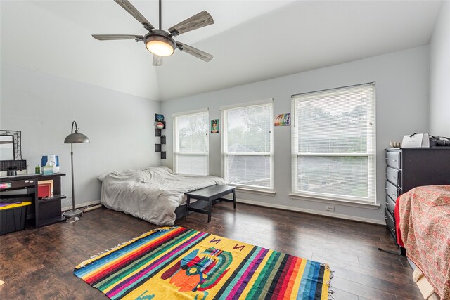 bedroom with lofted ceiling, multiple windows, dark wood-type flooring, and ceiling fan