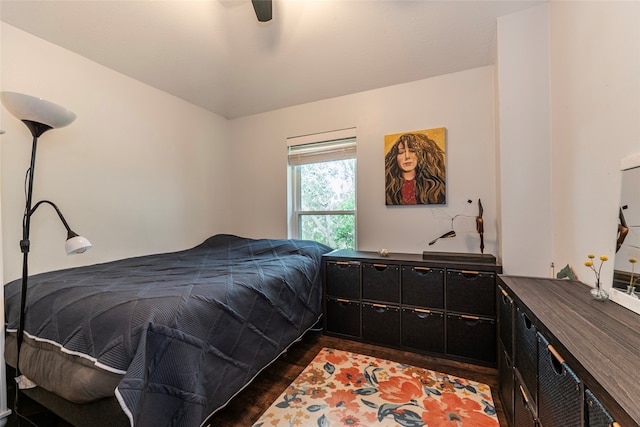 bedroom with ceiling fan and dark hardwood / wood-style floors