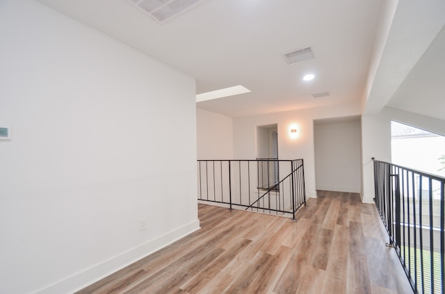 corridor featuring light hardwood / wood-style flooring