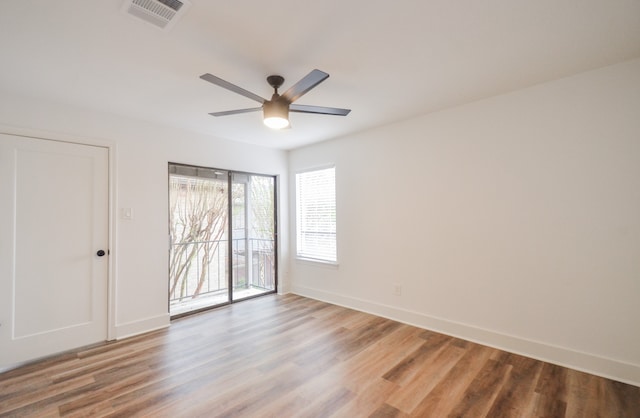 spare room featuring ceiling fan and hardwood / wood-style floors