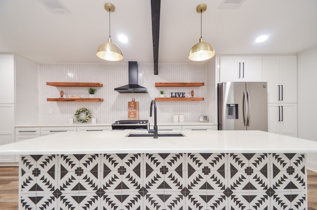 kitchen with white cabinetry, sink, wall chimney exhaust hood, stainless steel appliances, and light hardwood / wood-style floors