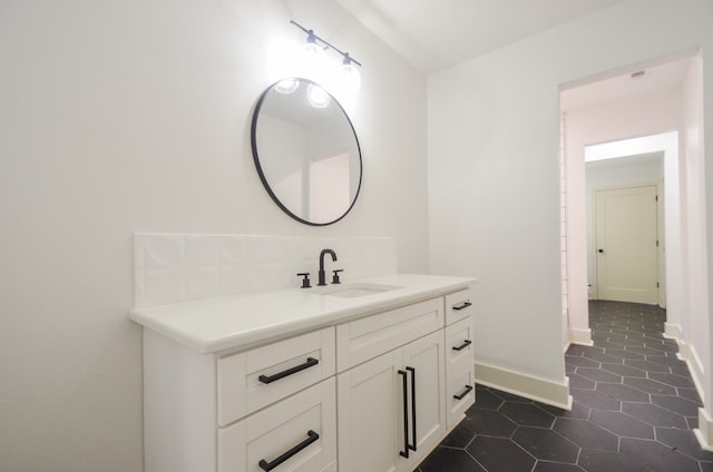 bathroom with tile patterned flooring and vanity