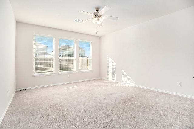 unfurnished room with light carpet and ceiling fan