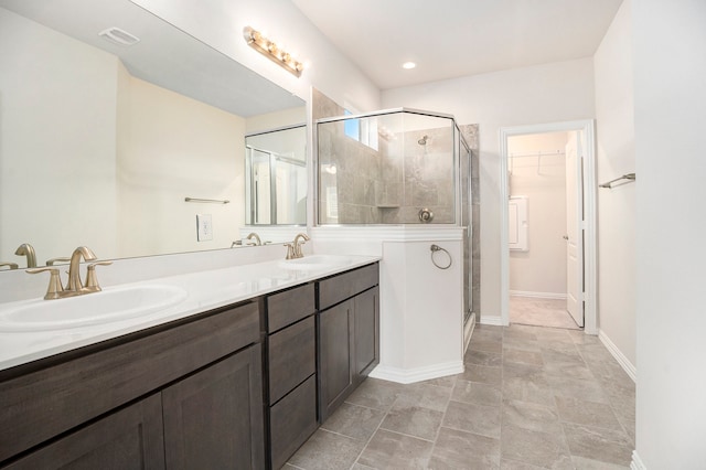 bathroom with vanity and an enclosed shower