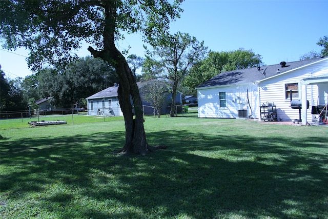 view of yard with central air condition unit