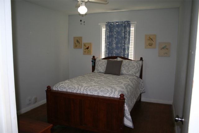 bedroom with ceiling fan and dark wood-type flooring