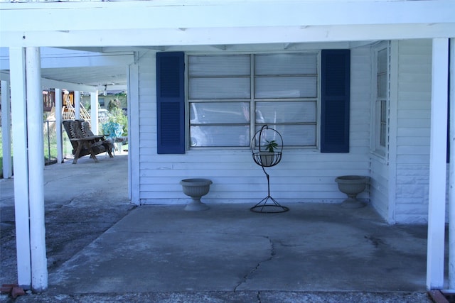 exterior space with a carport