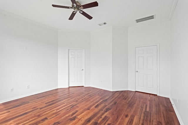 spare room with ceiling fan, dark hardwood / wood-style flooring, and ornamental molding