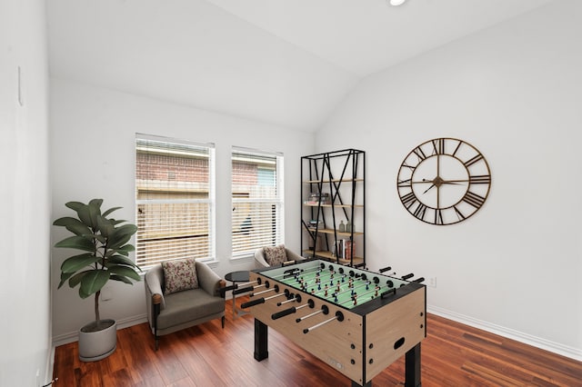 recreation room with dark hardwood / wood-style floors and lofted ceiling