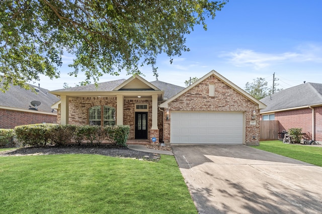 view of front of home with a garage and a front lawn